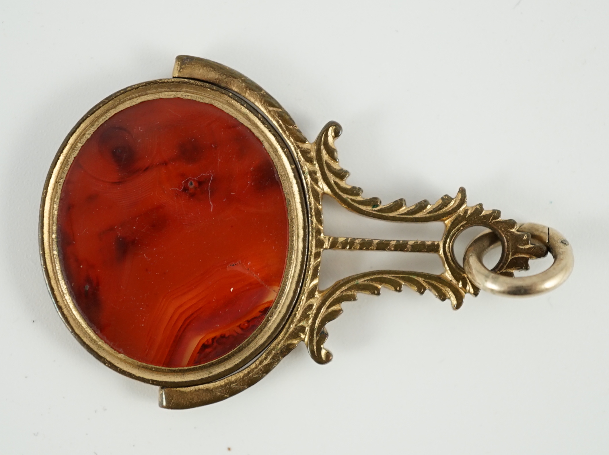 A late 18th/early 19th gilt metal mounted intaglio agate set swivelling fob seal, carved with the bust of Edmond Halley with the comet, 47mm, in original box.